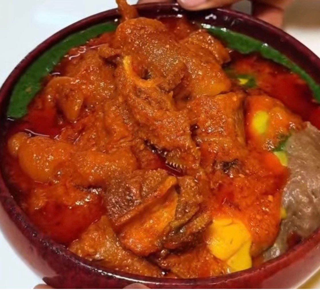Gbegiri Soup (Abula) with assorted meat in a bowl
