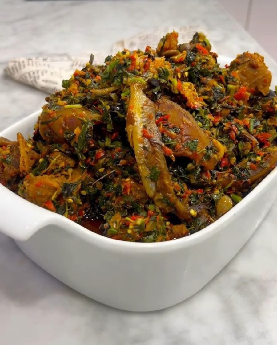 Vegetable fish stew in a white bowl
